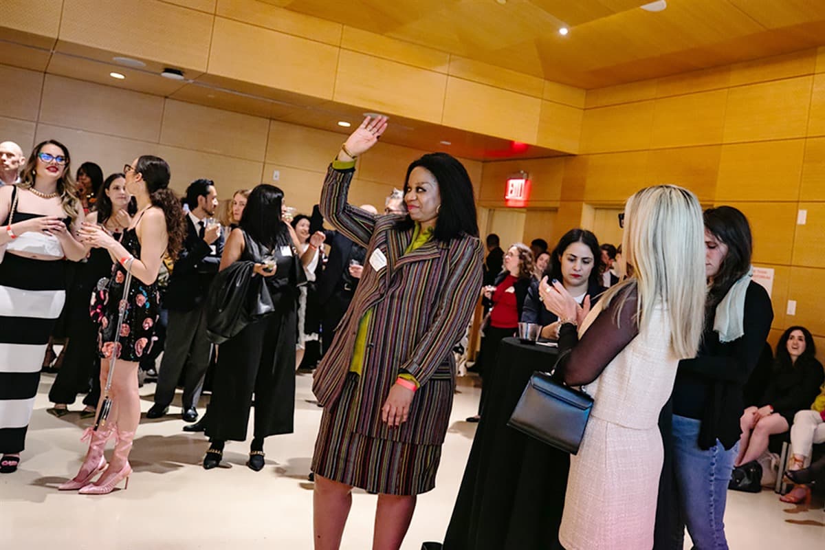 Attendees respond to remarks from President Joel Towers during the Forever New reception.