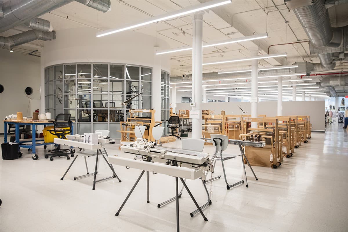 Studio with weaving looms and knitting machines